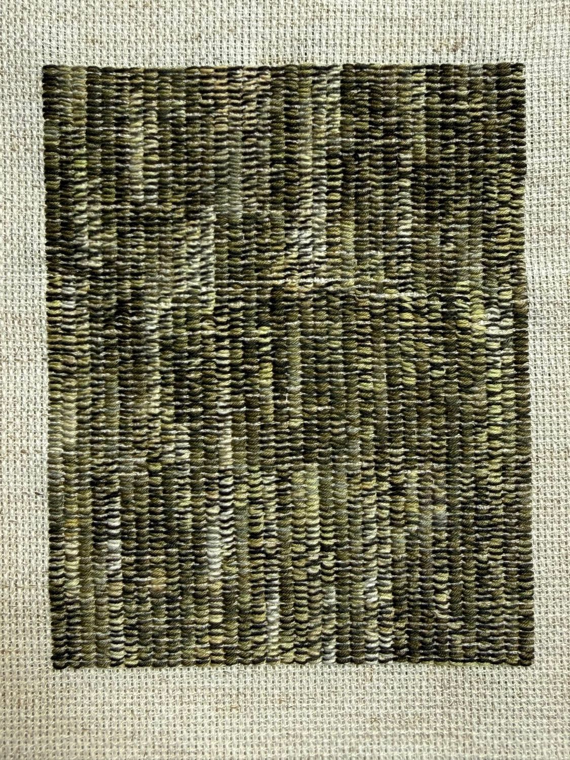 Frances Burden's Overhang: a dense rectangular block of embroidery in greens and olives, stitched onto raw canvas.