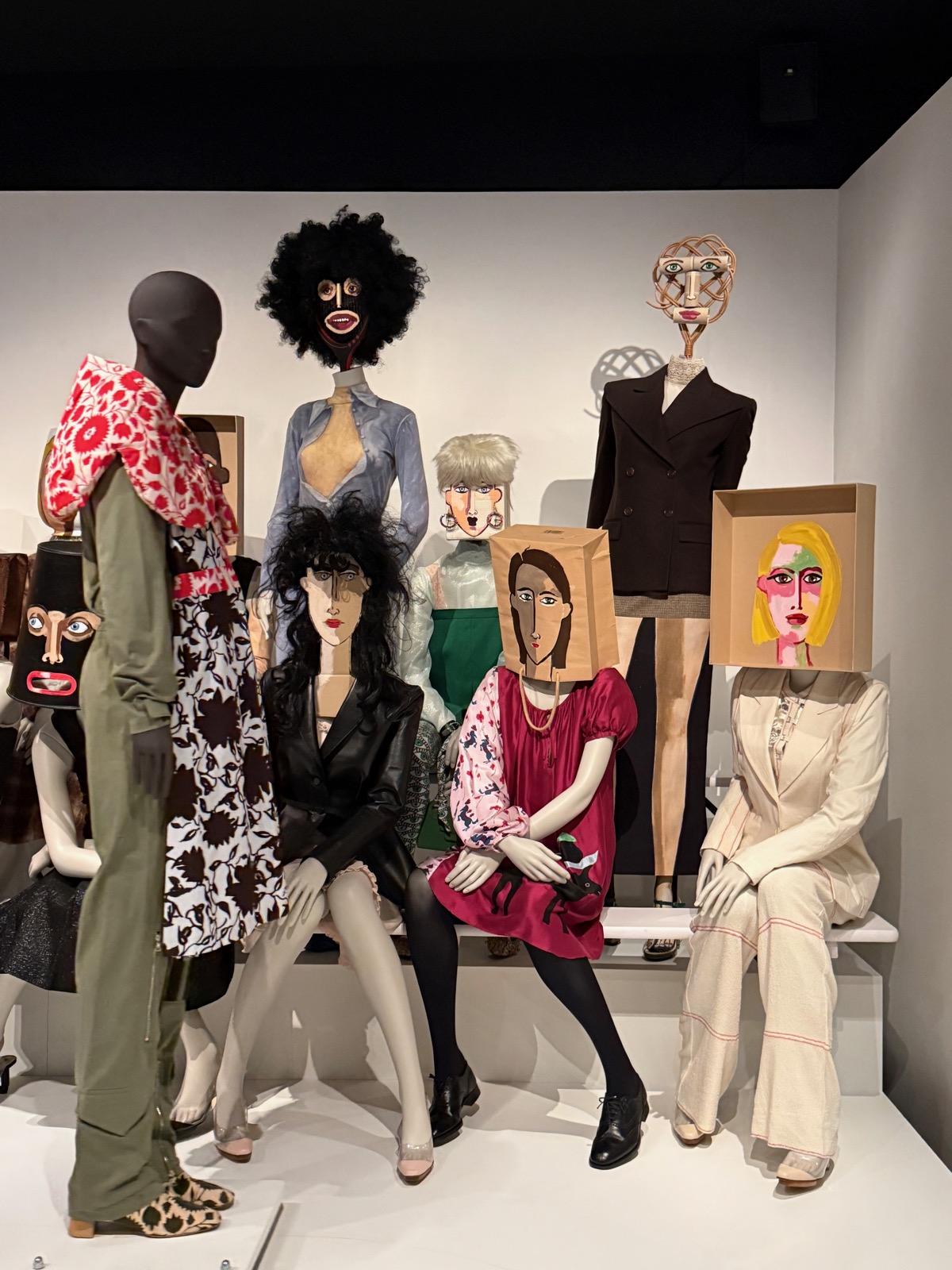 Dirk Van Saene's platform of mannequins, each crowned with a different hand-sculpted or painted head.