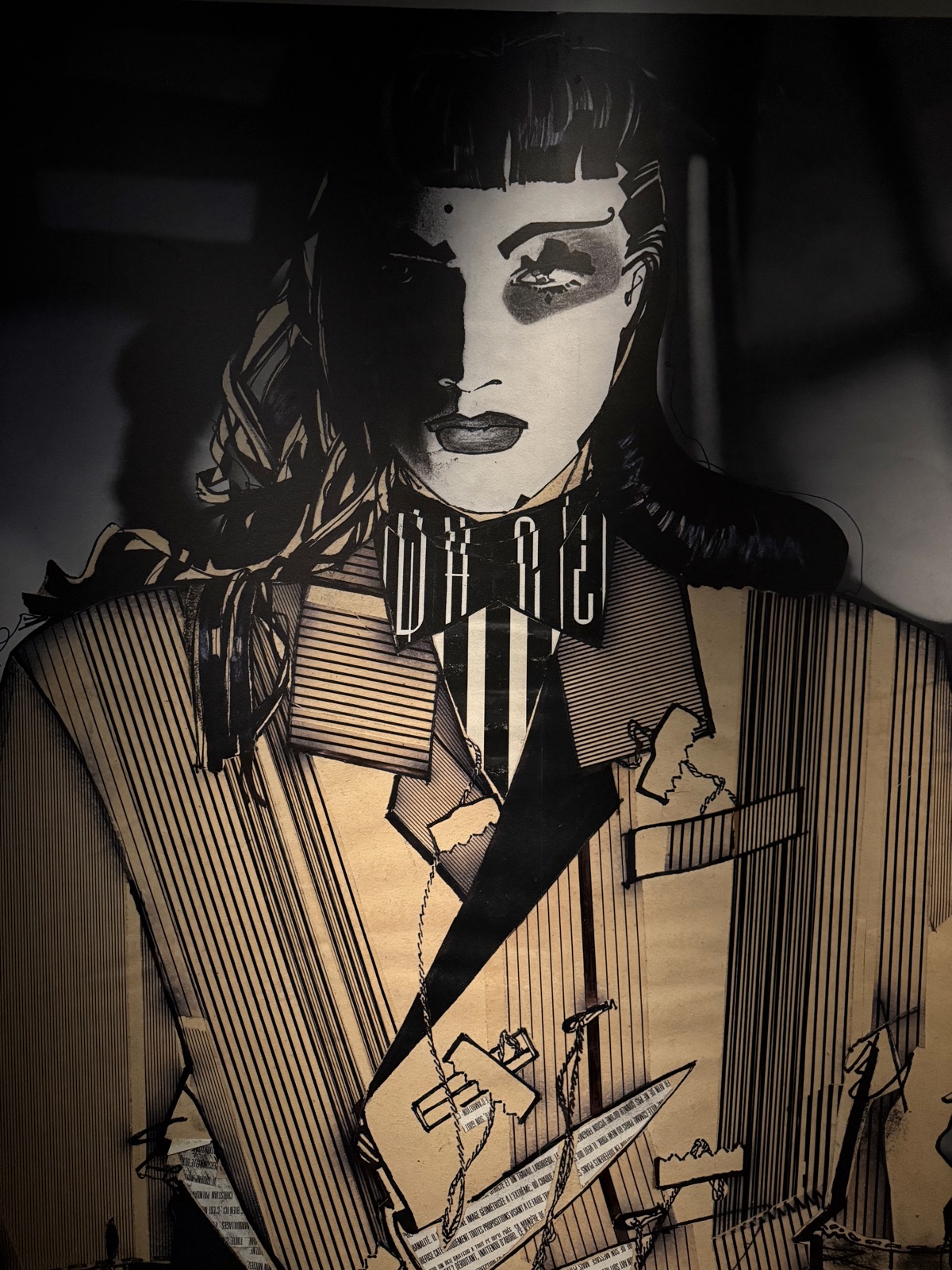 Marina Yee's wall: a large hand-drawn monochrome portrait of a figure in a striped suit.