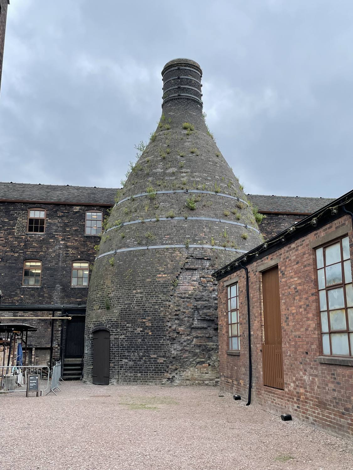 The brick bottle kiln surrounded by factory buildings at Middleport Pottery.
