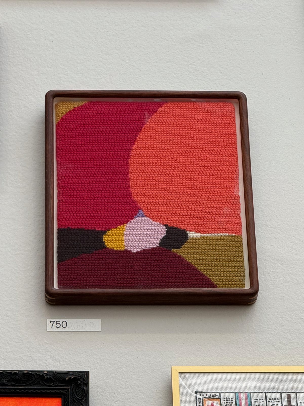 A hand-woven wool needlepoint by Helen Beard in bold colour.