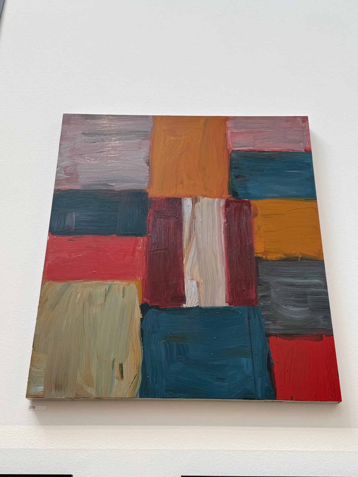 A larger Sean Scully painting in pink and red stacked blocks, on aluminium, in Gallery III.