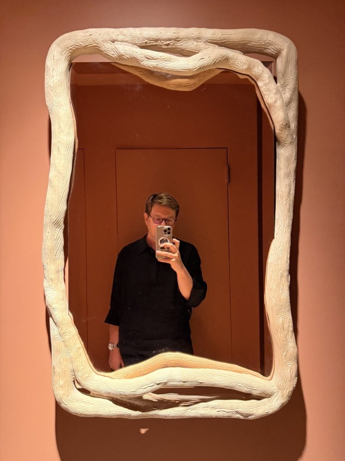 A ceramic-framed mirror at The Invisible Collection's townhouse on the Upper East Side.