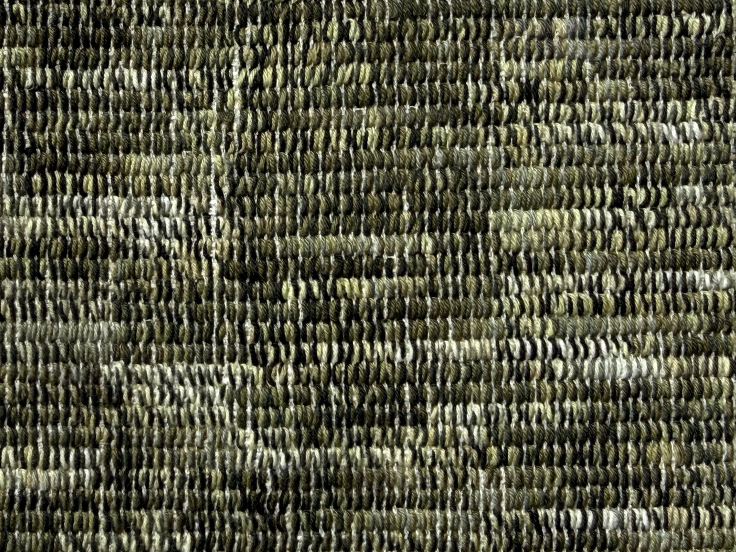 Detail of Overhang: hundreds of individual stitches in mixed green and olive yarns, the tension varying from stitch to stitch.