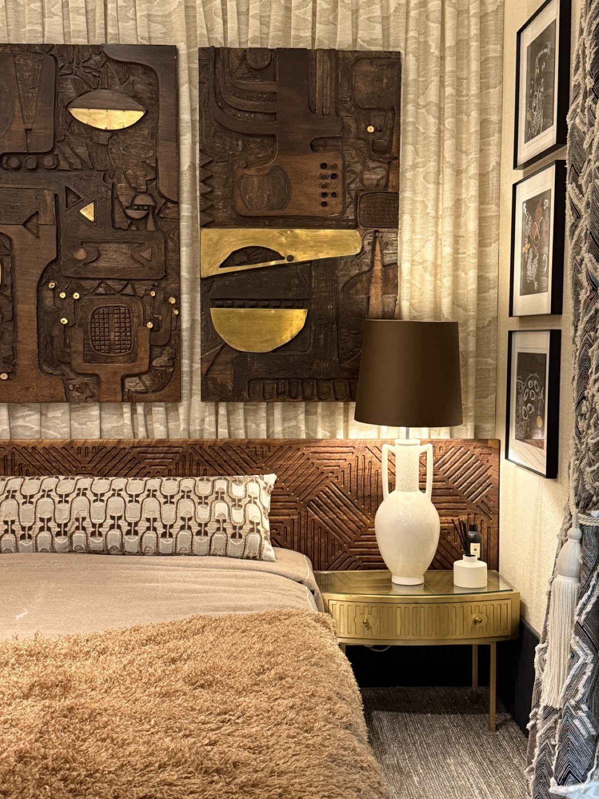 Joss Stoddart's carved headboard above the bed in the Misia suite.